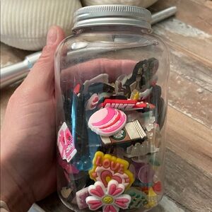 Jar Filled with 81 Croc Charms